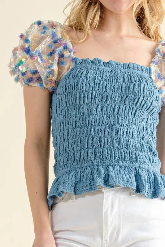 Blue Smocked Top with Multicolor Floral Puff Sleeves – Ruffled Hem Detail